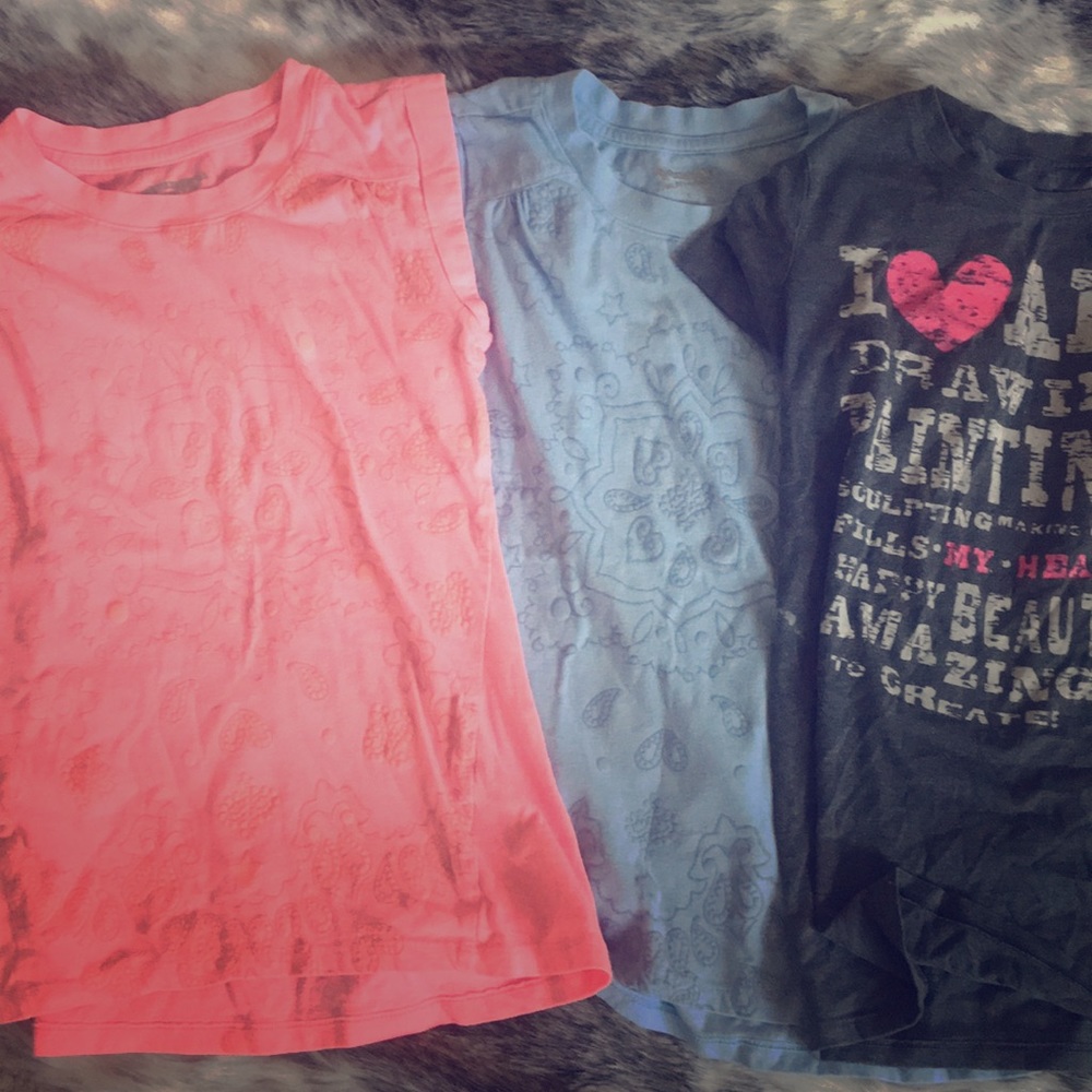 Three kids size shirts
